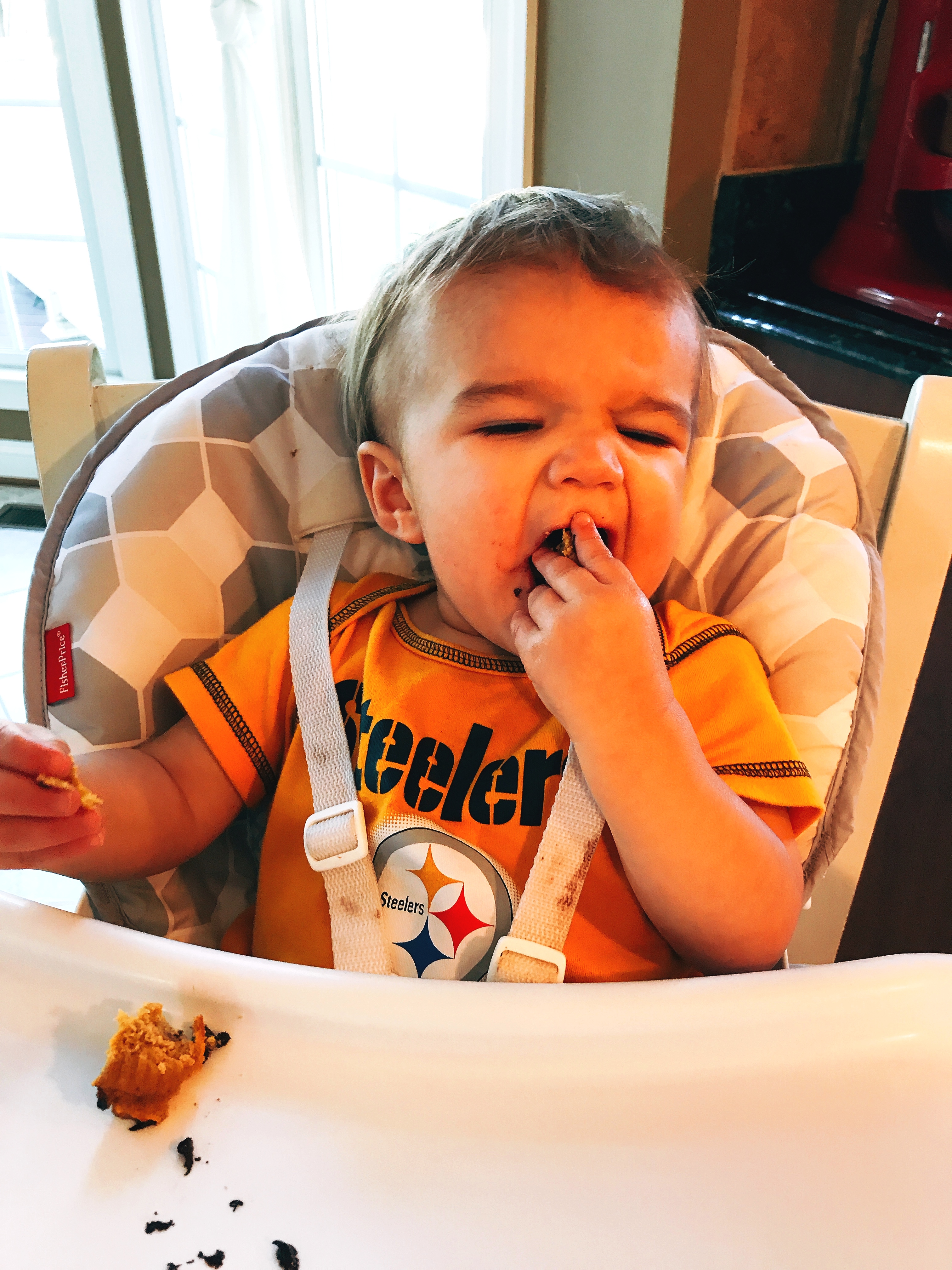 Toddler Grandson Enjoying a Pumpkin Spice Chocolate Chip Muffin baked by Mimi